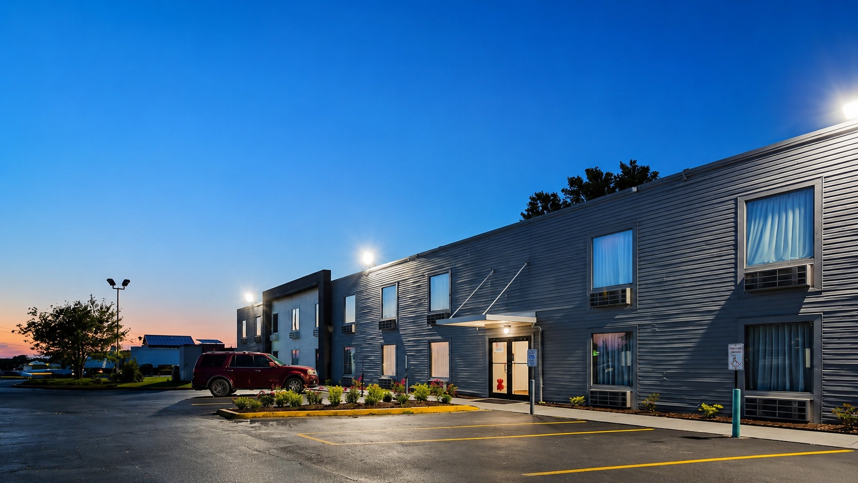 Welcome Inn motel exterior at dusk